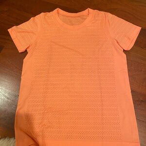 Lululemon Relaxed Fit in coral. Old Style but great condition. Woman’s Size 8